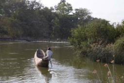 canoe rounding the river bend